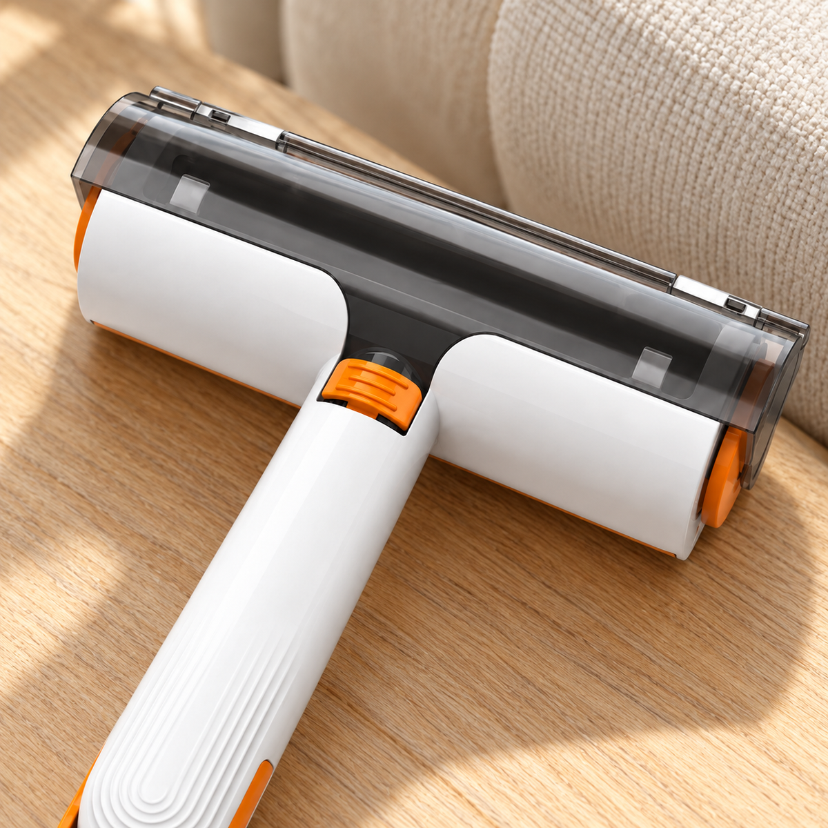 Close-up of the white and orange pet hair roller head and center button